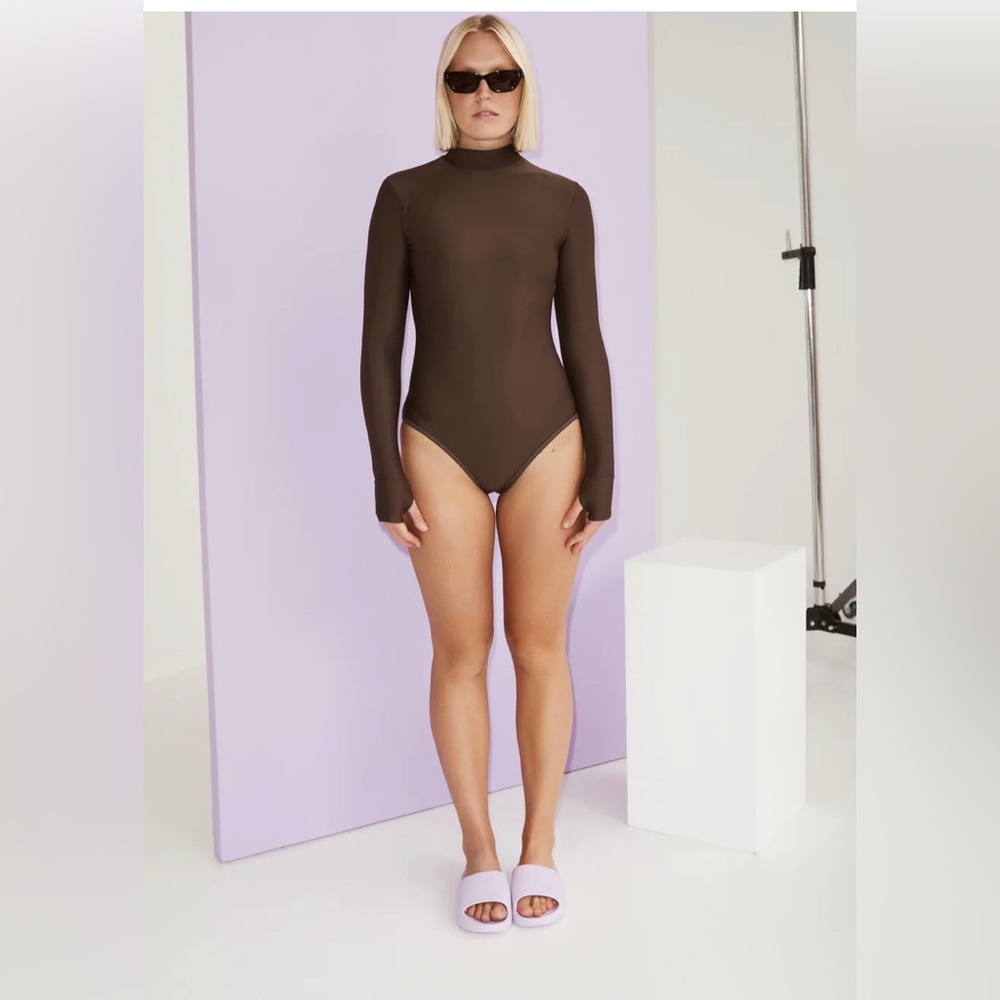 This turtleneck rash guard with hand covers is the ultimate water sport suit